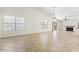 Spacious living room with tile flooring, large windows, and fireplace at 5450 E Paradise Ln, Scottsdale, AZ 85254