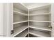 Walk-in pantry with multiple rows of shelving to maximize storage space at 5450 E Paradise Ln, Scottsdale, AZ 85254