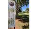 Desert Horizon Park sign with lush green grass and mature trees in the background at 5450 E Paradise Ln, Scottsdale, AZ 85254