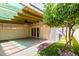 Back patio with a beam overhead, grass, and access to the house at 6025 N 10Th Pl, Phoenix, AZ 85014