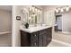 Modern bathroom featuring a marble countertop vanity and decorative mirror at 6025 N 10Th Pl, Phoenix, AZ 85014