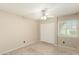 Bedroom featuring a ceiling fan, closet and window with louvers at 6025 N 10Th Pl, Phoenix, AZ 85014