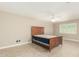 Bright bedroom with Saltillo tile flooring, a fan, and a large window at 6025 N 10Th Pl, Phoenix, AZ 85014