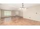 Spacious living room featuring Saltillo tile, neutral walls, and bright windows at 6025 N 10Th Pl, Phoenix, AZ 85014