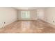 Open-concept living room with Saltillo tile flooring and abundant natural light at 6025 N 10Th Pl, Phoenix, AZ 85014