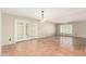Open living space with Saltillo tile, ceiling fan, and glass doors to the outside at 6025 N 10Th Pl, Phoenix, AZ 85014