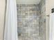 Tiled shower featuring a shower head and safety bar at 6025 N 10Th Pl, Phoenix, AZ 85014