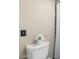Close-up of toilet with decorative flowers in a well-maintained bathroom at 6025 N 10Th Pl, Phoenix, AZ 85014