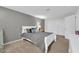 Serene bedroom with a gray-themed bed, a modern lamp, and ample closet space at 6708 W Utopia Rd, Glendale, AZ 85308
