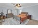 Comfortable bedroom featuring a large bed, dresser, and soft carpeting at 6708 W Utopia Rd, Glendale, AZ 85308