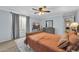 Comfortable bedroom with a large bed, fluffy rug, and natural light from the window at 6708 W Utopia Rd, Glendale, AZ 85308