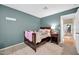 Cozy bedroom features a dark wood bed frame, soft carpet, and neutral wall color at 6708 W Utopia Rd, Glendale, AZ 85308