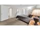 Bright bedroom with a large bed, natural light, and an en-suite bathroom at 6708 W Utopia Rd, Glendale, AZ 85308