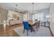 Elegant dining room showcasing a large wooden table, chandelier, and stylish decor at 6708 W Utopia Rd, Glendale, AZ 85308