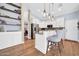 Well-lit kitchen featuring granite counters, stainless appliances, pendant lighting, and a breakfast bar at 6708 W Utopia Rd, Glendale, AZ 85308
