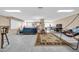 Expansive recreation room offering multiple entertainment zones with seating, games, and relaxation options at 6708 W Utopia Rd, Glendale, AZ 85308