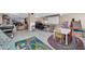 Large recreation room featuring an air hockey table, game area, and living space for endless possibilities at 6708 W Utopia Rd, Glendale, AZ 85308