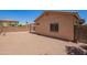 Backyard features a neutral color palette and a low-maintenance landscape at 674 E Renegade Pl, San Tan Valley, AZ 85143