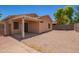 Backyard with a covered patio and privacy wall at 674 E Renegade Pl, San Tan Valley, AZ 85143