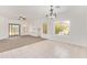 Dining area with tiled flooring, modern chandelier, and a sliding glass door to the backyard at 674 E Renegade Pl, San Tan Valley, AZ 85143