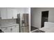 Modern kitchen features stainless steel refrigerator, ample cabinet space, and durable countertops at 674 E Renegade Pl, San Tan Valley, AZ 85143