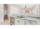 Open kitchen featuring stainless steel appliances, double sink, and bright lighting at 674 E Renegade Pl, San Tan Valley, AZ 85143