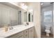 Bathroom with double sinks, vanity, and separate toilet and shower area at 699 S 197Th Dr, Buckeye, AZ 85326