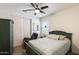 Bedroom featuring ceiling fan, window, closet, and patterned bedding at 699 S 197Th Dr, Buckeye, AZ 85326