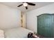 Cozy bedroom featuring a ceiling fan, closet, and neutral wall color at 699 S 197Th Dr, Buckeye, AZ 85326