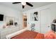 Bright bedroom features a ceiling fan, white dresser, and decor at 699 S 197Th Dr, Buckeye, AZ 85326