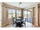 Cozy dining area near large windows and sliding doors allows for indoor and outdoor dining experiences at 699 S 197Th Dr, Buckeye, AZ 85326