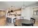 A dining room area next to the kitchen area provides the perfect setting for enjoying meals with Gathering and friends at 699 S 197Th Dr, Buckeye, AZ 85326