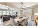 Open-concept dining area with views of the living room and backyard, showcasing neutral walls and plenty of natural light at 699 S 197Th Dr, Buckeye, AZ 85326