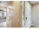 Bright entryway featuring tile flooring and a contemporary white door, offering a welcoming ambiance at 699 S 197Th Dr, Buckeye, AZ 85326