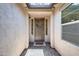 Charming front door with a decorative wreath and ample natural light, creating a welcoming entrance at 699 S 197Th Dr, Buckeye, AZ 85326
