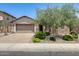 Charming single-story home with a well-manicured front yard and a two-car garage, great curb appeal at 699 S 197Th Dr, Buckeye, AZ 85326