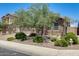 Charming single-story house with landscaped front yard, stone accents, and a spacious two-car garage at 699 S 197Th Dr, Buckeye, AZ 85326