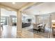 Open-concept living and dining area with neutral walls, tile flooring, and access to windows for natural light at 699 S 197Th Dr, Buckeye, AZ 85326