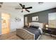 This main bedroom features a large decorative headboard and neutral color palette at 699 S 197Th Dr, Buckeye, AZ 85326