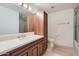 Bathroom features vanity with cabinets, decorative lights, and neutral tile flooring at 7151 E Rancho Vista Dr # 6002, Scottsdale, AZ 85251