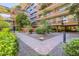 Beautiful landscaped courtyard featuring brick pathways and lush green plants at 7151 E Rancho Vista Dr # 6002, Scottsdale, AZ 85251