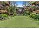 Serene courtyard featuring a putting green, lush landscaping, and inviting outdoor spaces at 7151 E Rancho Vista Dr # 6002, Scottsdale, AZ 85251