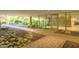 Building entrance showcasing modern architecture, mature trees, and landscaped areas at 7151 E Rancho Vista Dr # 6002, Scottsdale, AZ 85251