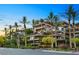 Beautiful building featuring multiple balconies, lush landscaping, and well-maintained surroundings at 7151 E Rancho Vista Dr # 6002, Scottsdale, AZ 85251