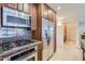 Modern kitchen with stainless steel appliances, granite counters and cabinetry at 7151 E Rancho Vista Dr # 6002, Scottsdale, AZ 85251