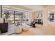 Contemporary living room featuring a comfortable sofa, stylish decor, and large windows at 7151 E Rancho Vista Dr # 6002, Scottsdale, AZ 85251