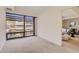 Bright living room featuring a large window with city views and neutral carpeting at 7151 E Rancho Vista Dr # 6002, Scottsdale, AZ 85251