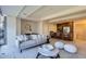 Open-concept living room with adjacent kitchen, neutral decor, and comfortable seating arrangement at 7151 E Rancho Vista Dr # 6002, Scottsdale, AZ 85251