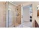 Tiled shower with glass enclosure featuring stone-look walls and a ceiling-mounted shower head at 7151 E Rancho Vista Dr # 6002, Scottsdale, AZ 85251