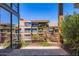 Terrace view of neighborhood condominiums, metal safety railings, plants, and clear blue sky at 7151 E Rancho Vista Dr # 6002, Scottsdale, AZ 85251